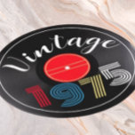 Vintage 1975 Retro Stripe Record 50th Birthday Round Paper Coaster<br><div class="desc">This design features 'Vintage' is a white retro typography and the retro-stripe numerals 1975 in fun,  primary colors,  with a vinyl record in the background,  and on a unique,  round invitation.</div>