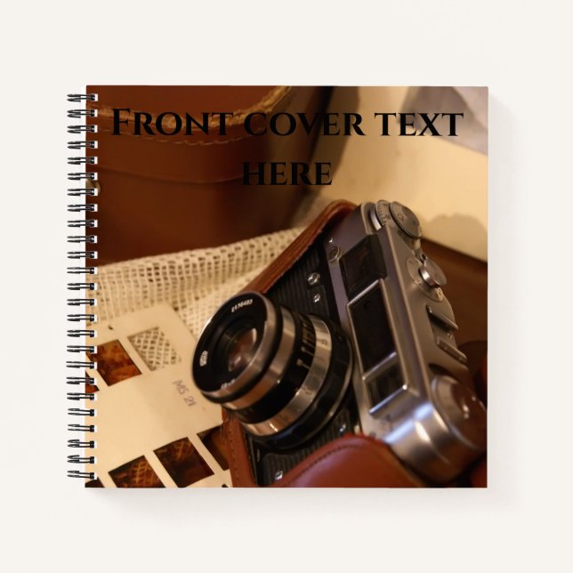 Vintage analog camera in leather brown case notebook (Front)