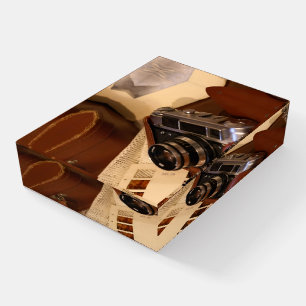 Vintage analog camera in leather brown case paperweight