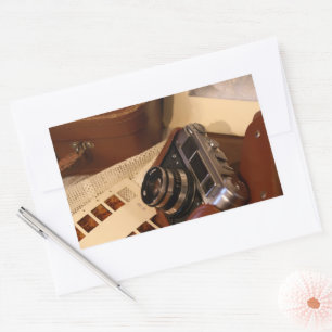 Vintage analog camera in leather brown case rectangular sticker