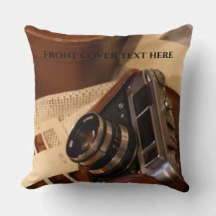 Vintage analog camera in leather brown case throw pillow