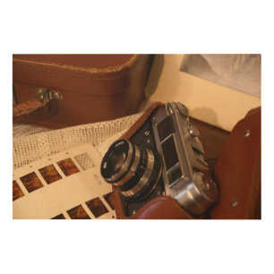 Vintage analog camera in leather brown case wood wall art