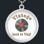 Vintage - Back to Vinyl, the record is back Silver Plated Necklace<br><div class="desc">The design features a stylized black vinyl record with realistic grooves and a glossy effect. The middle label is red and contains the words “50s, 60s, 70s, 80s, 90s” arranged in a circle around the middle - a homage to the musical decades. Above the record, the word “Vintage” is shown...</div>