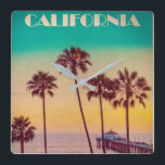 Vintage California Sunset Beach Square Wall Clock<br><div class="desc">EXCLUSIVE to Vintage republic: Retro style California travel poster design featuring Manhattan beach pier at sunset. In the foreground are a stand of palm trees against a yellow and aqua green sunset</div>