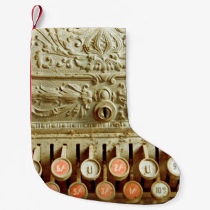 Vintage cash register, covered in dust and cobweb small christmas stocking