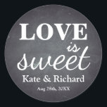Vintage Chalkboard Love is Sweet Wedding Classic Round Sticker<br><div class="desc">This is vintage style Love is Sweet Wedding. This wedding favor stickers feature is a "Love is Sweet" with a monogram of the bride and groom names and wedding date and with a soft white chalk appearance on a rustic black board background with textured look.You can add your favorite photo....</div>