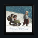 Vintage Children Sledding Christmas Winter Keepsake Box<br><div class="desc">Vintage Sledding - This vintage Christmas card is based on an old-fashioned photograph, which captures two little children sitting on a sled, while an older child pulls the sled. It's Christmas time, and snow is all around! The vintage photograph is from 1912. The antique children capture the wonder of Christmas,...</div>