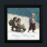 Vintage Children Sledding Christmas Winter Keepsake Box<br><div class="desc">Vintage Sledding This vintage Christmas card is based on an old-fashioned studio photograph, which captures two little children sitting on a sled, while an older child pulls the sled. It's Christmas time, and snow is all around! The vintage photograph is from 1912 -- 100 years old! These antique children capture...</div>