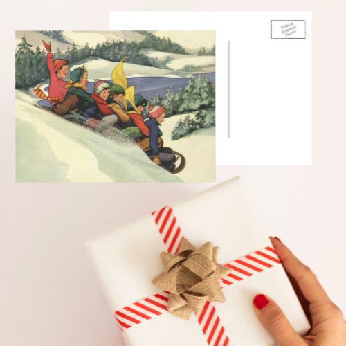 Vintage Christmas Children Sledding on a Mountain Holiday Postcard