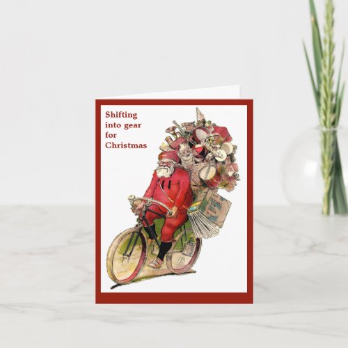 Vintage Christmas image of santa on bicycle bike Holiday Card
