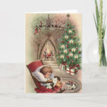 Vintage Christmas Kitten Sleeping Baby Fireplace Holiday Card<br><div class="desc">Vintage Christmas Kitten Sleeping Baby Fireplace Holiday Card. This design features a sleeping kitten and baby in front of a fireplace and Christmas tree. What a beautiful retro holiday scene. Personalize this custom design with your own inside greeting.</div>