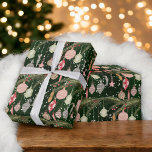 Vintage Christmas Ornament Illustration Pattern Wrapping Paper<br><div class="desc">This festive wrapping paper features a nostalgic pattern of hand-drawn vintage Christmas ornaments hanging from a pine garland on a deep green background. The elegant design, with its mix of red, gold, and green tones, adds a whimsical touch to your holiday gift-giving. Perfect for wrapping presents with a charming, retro...</div>