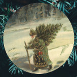 Vintage Christmas, Santa Claus Carrying a Tree Classic Round Sticker<br><div class="desc">Vintage illustration antique Victorian Merry Christmas holiday design featuring an old man resembling jolly old Saint Nicholas. He is carrying a pine tree through the forest during winter leaving only footprints behind in the snow.</div>