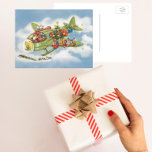 Vintage Christmas, Santa Claus Flying an Airplane Holiday Postcard<br><div class="desc">Vintage illustration Merry Christmas holiday travel and transportation design featuring a jolly Santa Claus flying an old fashioned propeller aircraft in the sky with elves, toys, dolls, wrapped presents and a Christmas tree on the wing. They are flying the antique plane through the fluffy white clouds and stars in the...</div>