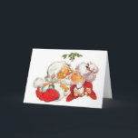Vintage Christmas Santa Kissing Mrs Claus Holiday Card<br><div class="desc">Santa Claus is giving Mrs Claus a kiss under the mistletoe in this sweet vinatge design. A great way to celebrate love this Christmas!</div>