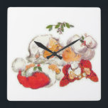 Vintage Christmas Santa Kissing Mrs Claus Square Wall Clock<br><div class="desc">Santa Claus is giving Mrs Claus a kiss under the mistletoe in this sweet vinatge design. A great way to celebrate love this Christmas!</div>