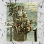 Vintage Christmas, Victorian Santa Claus with Toys Jigsaw Puzzle<br><div class="desc">Vintage illustration Christmas holiday design featuring a Victorian Santa Claus walking through the snow leaving footprints. He is carrying a Christmas tree and a basket of toys on a cloudy evening with the moon shining through the clouds. Originally a Scandinavian postcard with the text: God Jul or Merry Christmas.</div>
