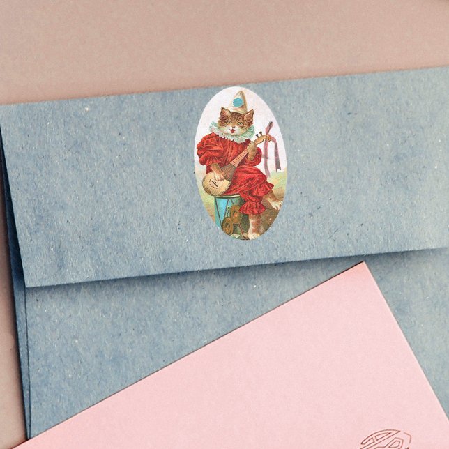 Vintage Clown Jester Musician Cat Mandolin Oval Sticker (Cat playing music in red Jester outfit sitting on drum on oval stickers.)