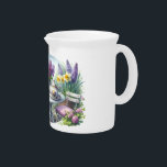 Vintage Floral Tea Party in Garden Beverage Pitcher<br><div class="desc">Step into a dreamy vintage floral tea party surrounded by lush blooms and timeless charm. This enchanting artwork captures the essence of a cottagecore aesthetic, featuring a delicate garden tea time scene set against a backdrop of daffodils, hyacinths, and violets in full spring bloom. A classic porcelain teapot and teacup...</div>