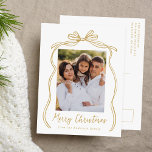 Vintage Gold Bow Merry Christmas Photo Holiday Postcard<br><div class="desc">Celebrate the holiday season with this charming Christmas postcard featuring your family's photo framed by a festive gold bow and ribbon on a crisp white background. "Merry Christmas" is elegantly written in a charming gold handwritten script, with space to personalize your family name below. The back of the postcard displays...</div>