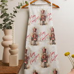 Vintage Nutcracker & Merry Christmas Apron<br><div class="desc">A beautifully illustrated vintage-style Nutcracker soldier, resplendent in his classic attire, stands tall, holding a Merry Christmas banner. The rich, warm colors and intricate details evoke a sense of yuletide nostalgia, making it a perfect choice for those who appreciate the classic holiday aesthetics. May your holiday season be filled with...</div>