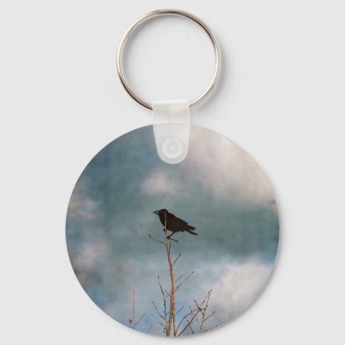 Vintage photograph of a crow on a tree keychain