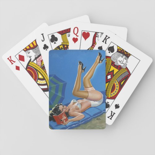 Vintage pinup girl reading book in the sun playing cards