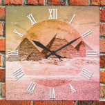 Vintage Pyramids in Cairo desert, Ancient Egypt Square Wall Clock<br><div class="desc">Wall Clocks: Vintage art clock featuring Ancient Pyramids in the desert on outskitrts of Cairo, Egypt. View on all of the pyramids in line is highlighting magnificence of the area. Top of Great Pyramid is still covered with flat decorative stone desks and let us imagine, what amazing view it must...</div>