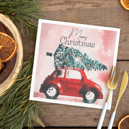 Vintage Red Car with a Christmas Tree Tied to Roof