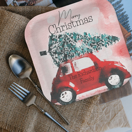Vintage Red Car with a Christmas Tree Tied to Roof