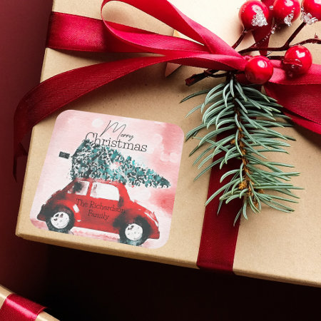 Vintage Red Car with a Christmas Tree Tied to Roof