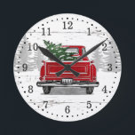 Vintage Red Truck Christmas Tree Rustic Wood Round Clock<br><div class="desc">This rustic holiday wall clock features a vintage red truck with Christmas tree in the back on a background of faux white and gray weathered wood. Personalize with the year on the license plate. Hour numbers and dots for minutes/seconds are included. Happy Holidays!</div>