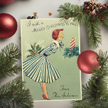 Vintage Retro 1950s Christmas Lady Custom Holiday Card<br><div class="desc">This mid-century vintage Christmas card features a lady dressed in a green and white striped dress, holding a bouquet of Christmas greenery, and blowing out a red and white striped Christmas candle. Personalize by adding your family name at the bottom of the card, customizing the message inside the card and/or...</div>