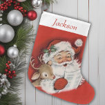 Vintage Retro Santa And Reindeer Personalized Large Christmas Stocking<br><div class="desc">This Vintage Retro Santa and Reindeer Personalized Christmas Stocking is the perfect blend of nostalgia and charm, bringing a touch of classic holiday spirit to your festive decor. This stocking features a delightful, old-fashioned illustration of Santa Claus and his trusty reindeer, reminiscent of cherished childhood memories. The vibrant colors and...</div>