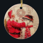 Vintage Santa Claus Snowman Christmas Ceramic Ornament<br><div class="desc">This design features a jovial Santa Claus and snowman in the snow. 
 #christmas #santa #cute #decoration</div>