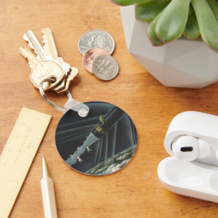 Vintage Science Fiction Astronaut Riding a Rocket Keychain