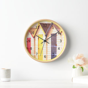 Vintage, shabby chic, seaside beach huts, yellow clock