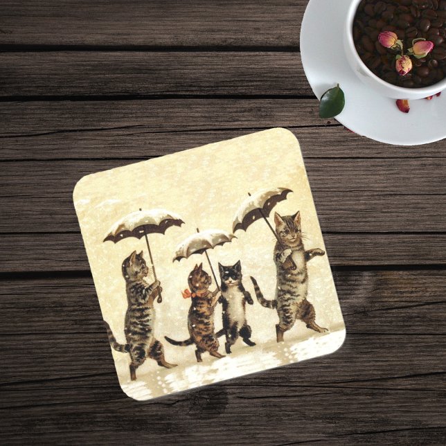 Vintage Striped Cats Umbrellas Dancing Snow Drink Coaster (Four brown cats walking in snow with umbrellas on drink coaster in yellow.)