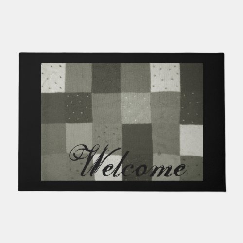 vintage style black and white knitted patchwork doormat