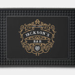 Vintage Style Custom Name Year Gold Black & White Bar Mat<br><div class="desc">Add an elegant touch to your home bar with this custom bar mat featuring a sophisticated vintage design. The black background is adorned with intricate golden scrollwork framing your personalized bar name in classic white lettering, creating a refined and timeless look. The design is complemented by a hop emblem, adding...</div>