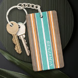 Vintage Surfboard Stripes - Subtle Wood Background Keychain<br><div class="desc">A colorful, retro stripe design in aqua blue and orange on a faux wood print background. A vintage surfboard stripe design with a beach and surf look. Add your name or monogram to make this a personal phone case that will stand out amongst your friends. The name is a thin...</div>