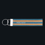 Vintage Surfboard Stripes - Subtle Wood Wrist Keychain<br><div class="desc">A colorful, retro stripe design in blue and orange on a faux wood print background. A vintage surfboard stripe design with a beach and surf look. Add your name or monogram to make this a personal phone case that will stand out amongst your friends. The name is a thin serif...</div>