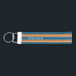 Vintage Surfboard Stripes - Subtle Wood Wrist Keychain<br><div class="desc">A colorful, retro stripe design in blue and orange on a faux wood print background. A vintage surfboard stripe design with a beach and surf look. Add your name or monogram to make this a personal phone case that will stand out amongst your friends. The name is a thin serif...</div>