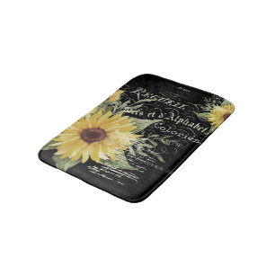 Vintage typography and sunflowers on black bath mat