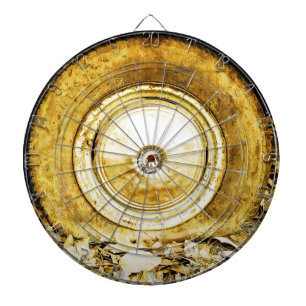 Vintage wheel on autumn leaves dart board