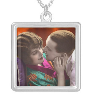 vintage woman and man in romantic embrace silver plated necklace