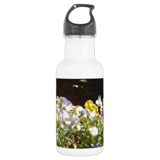 Violas In A Stone Trough. Water Bottle
