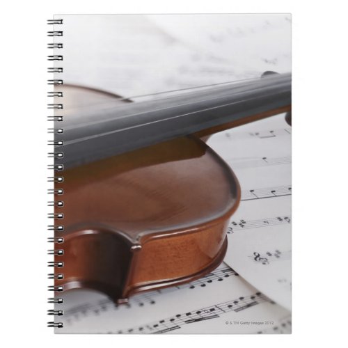 Violin and sheet music notebook