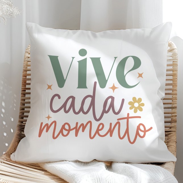 "Vive Cada Momento" Inspirational Quote Throw Pillow ("Vive Cada Momento" Inspirational Quote Throw Pillow in a sunny rattan armchair.)