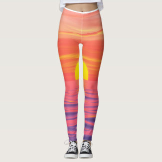 Vivid color sunset on the beach leggings